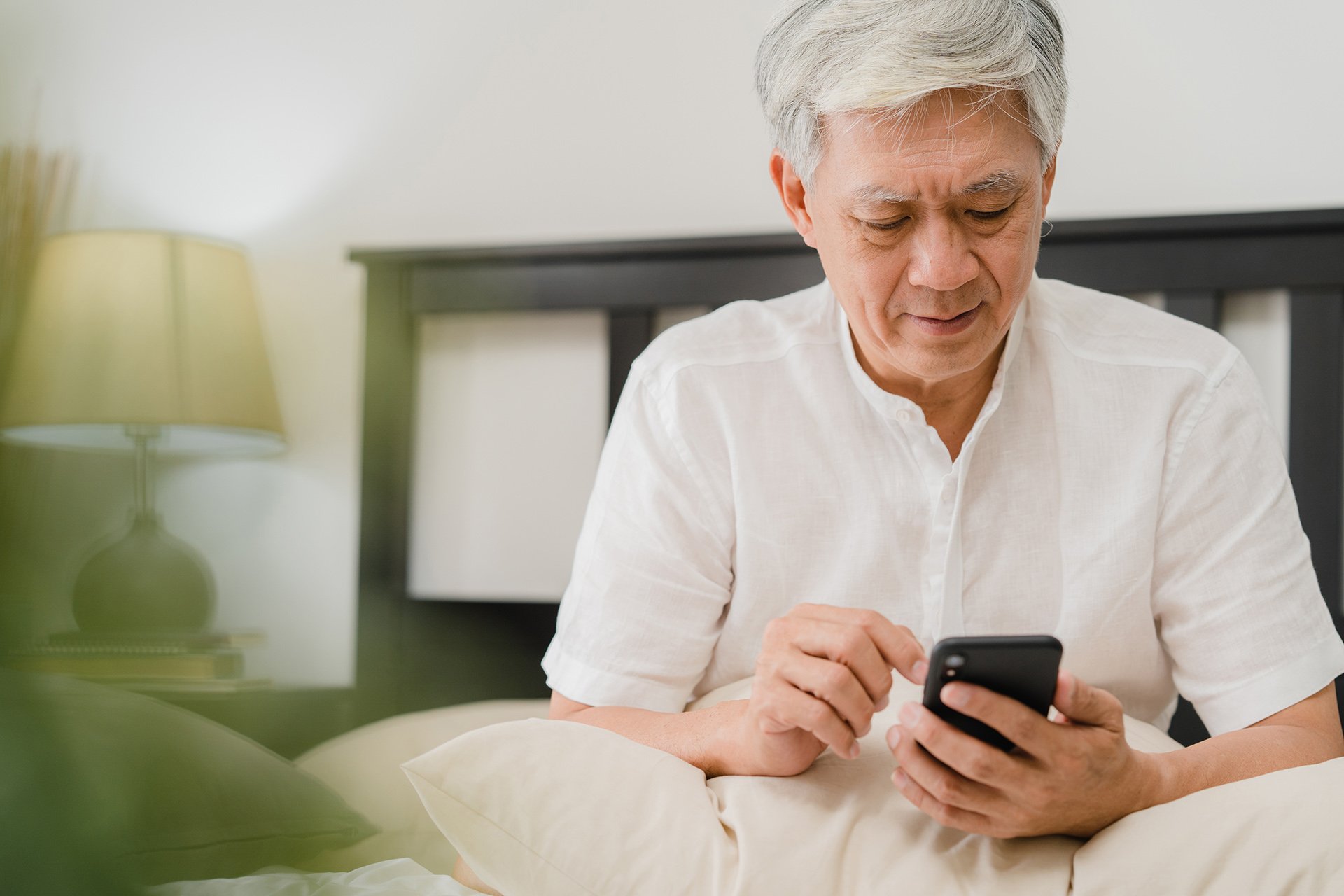 Older man using a mobile device